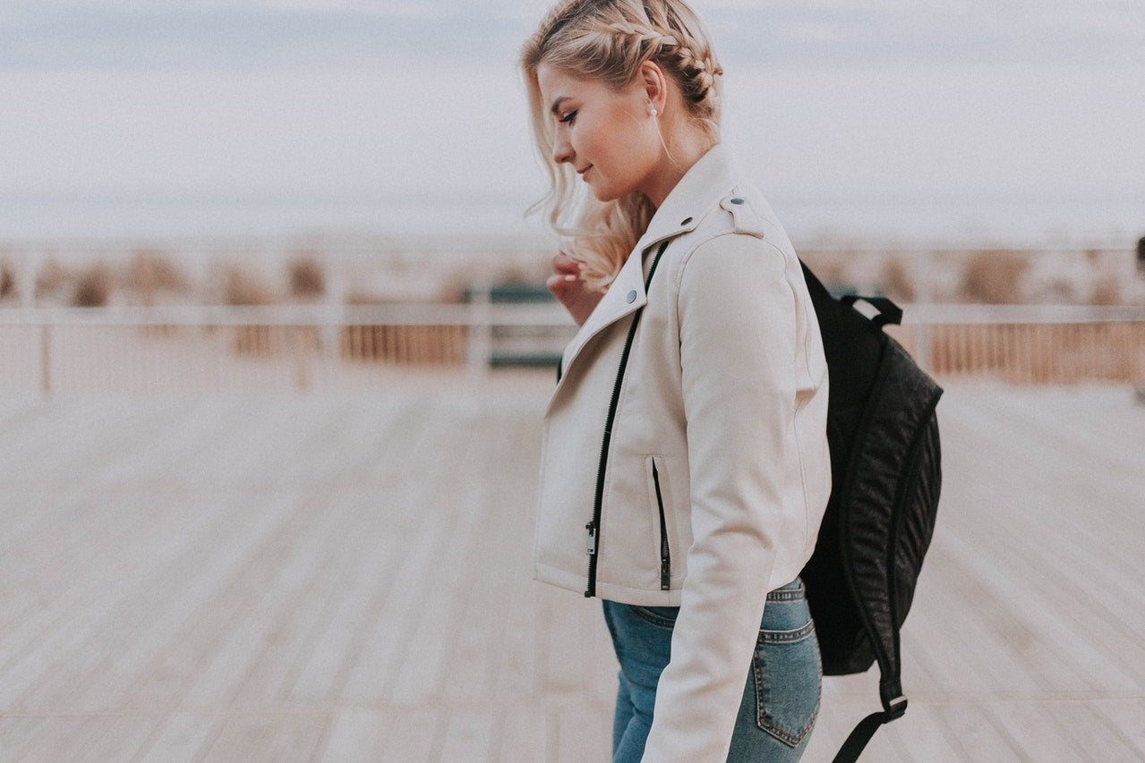 woman wearing white leather jacket