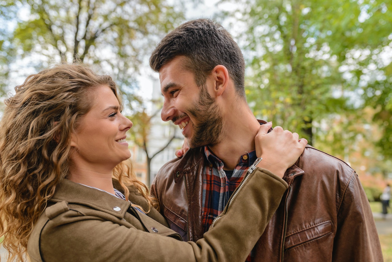 man and woman wearing leather jacket